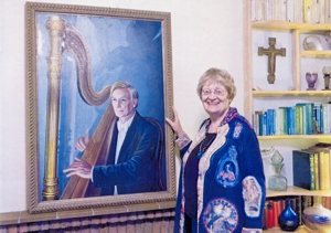 The artist with her portrait of David Watkins